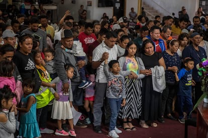 Mexican migrants, many from Michoacan state, attend a religious service at the Embajadores de Jesus Christian migrant shelter in Tijuana, Mexico, Sept. 26, 2023.