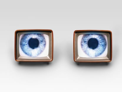 Two old fashioned TV sets with blue eyes in studio shot