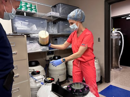 Dr. Andrew Harper, medical director for Huntsville Reproductive Medicine, P.C., looks on as Lynn Curry, nurse practitioner, opens IVF cryopreservation dewar in Madison, Alabama, March 4, 2024.