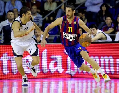 Juan Carlos Navarro y Omer Onan, durante el partido de la Euroliga 2010/ 11 entre el Regal FC Barcelona y el Fenerbahce Ulker, en el Palau Blaugrana.