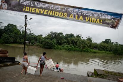 The first women to return begin the usual tasks of living on the river.