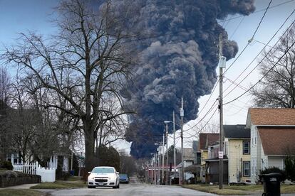 A black plume rises over East Palestine, Ohio, as a result of a controlled detonation of a portion of the derailed Norfolk Southern trains, on Feb. 6, 2023.