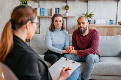 Young married couple having a marriage counseling session to fix the problems in their relationship