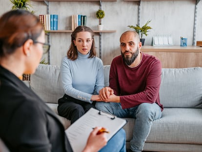 Young married couple having a marriage counseling session to fix the problems in their relationship