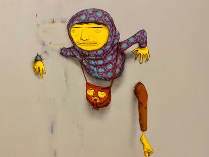 Intervenção dos Osgemeos sobre seu grafite apagado pelas autoridades paulistas.