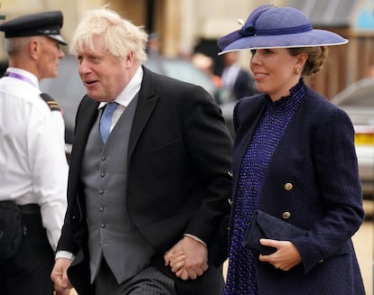 Former prime minister Boris Johnson and his wife Carrie Johnson arrive at the Coronation of King Charles III and Queen Camilla on May 6, 2023 in London, England.