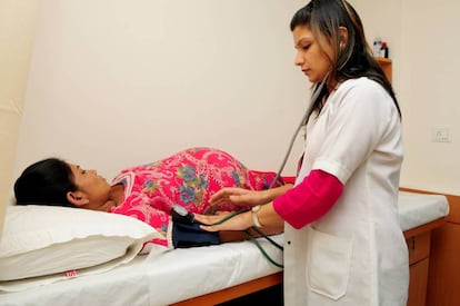 A surrogate mother undergoing a medical exam in India.