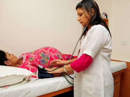 A surrogate mother undergoing a medical exam in India.