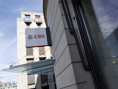 The logos of the Swiss banks UBS and Credit Suisse are displayed on different buildings in Geneva, Switzerland, on March 20, 2023.