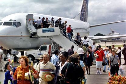 Passengers on a chartered flight from Florida arrive in Havana.