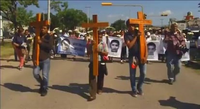 Families of the missing students attend a march.