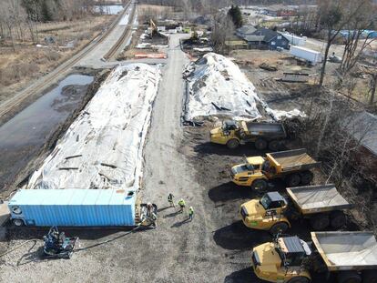 This photo released March 10, 2023, by the Ohio governor's office, shows covered piles of soils contaminated with vinyl chloride after a February train derailment in East Palestine.