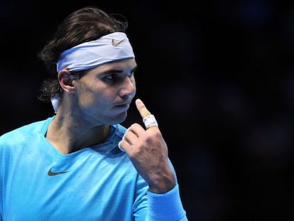 Spain&#039;s Rafael Nadal asks for a review of a line call during his group A singles match against David Ferrer.