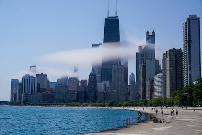The Chicago city skyline is covered by the fog lifted off Lake Michigan on August 5, 2022, in Chicago.