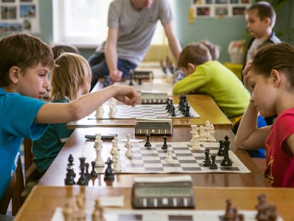 Kids playing chess, indoors