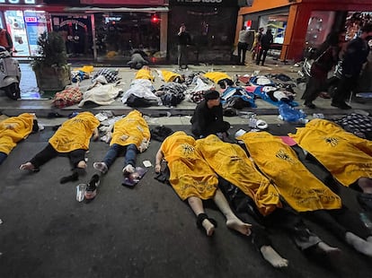 An emergency responder at the scene of the tragedy in Itaewon. 