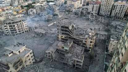 This aerial photo show heavily damaged buildings following Israeli airstrikes in Gaza City on October 10, 2023. 