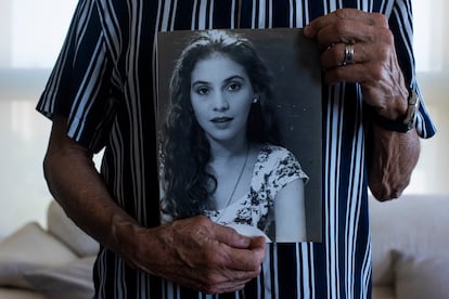 Martin Mestre with a portrait of Nancy Mariana.