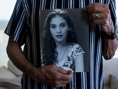 Martin Mestre with a portrait of Nancy Mariana.