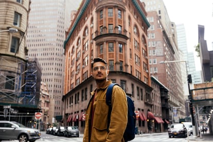 A student walks on the street in New York City.