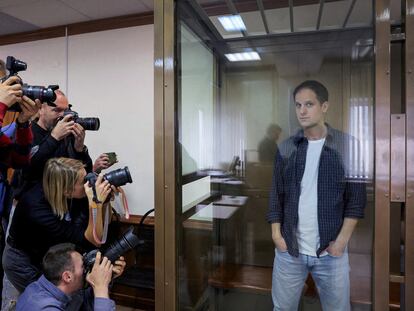 'Wall Street Journal' reporter Evan Gershkovich stands inside an enclosure for defendants before a court hearing to consider an appeal against his pre-trial detention on espionage charges in Moscow, Russia, October 10, 2023.