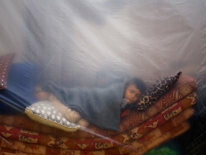 A child sleeps in a camp for displaced people in Rafah, in the south of the Gaza Strip, on December 5.