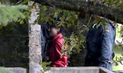 Rosario Porto (left) during a search conducted of her family's property in Teo, Santiago on Friday.