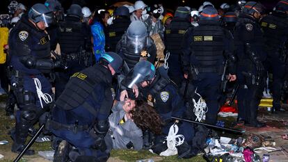 Officers detain a protester at UCLA during a pro-Palestinian protest on May 2, 2024. 