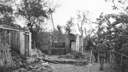 American soldiers look over the remains of a home in My Lai, South Vietnam, in this Jan. 8, 1970 file photo, two years after the massacre.