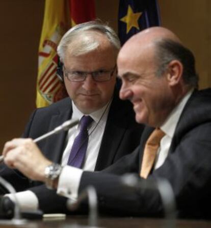 El ministro de Economía y Competitividad, Luis de Guindos, y el comisario de asuntos económicos de la Comisión Europea, Olli Rehn
