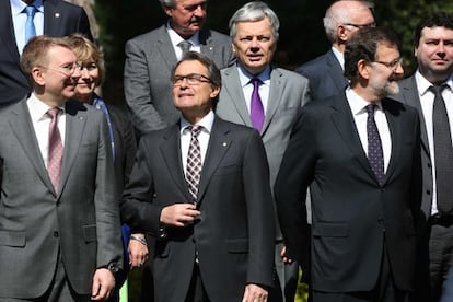 Catalan premier Artur Mas (second from left) and Prime Minister Mariano Rajoy (right) with EU foreign ministers in Barcelona.