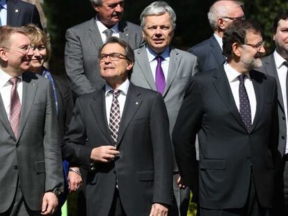 Catalan premier Artur Mas (second from left) and Prime Minister Mariano Rajoy (right) with EU foreign ministers in Barcelona.