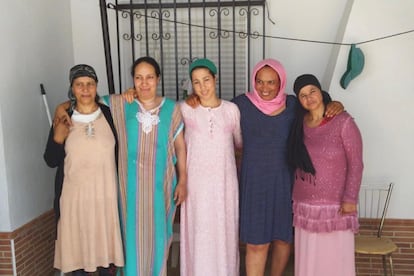 (l-r) Fatna, Saidia, Najiya and two other migrant workers from Morocco outside their home in Huelva province.