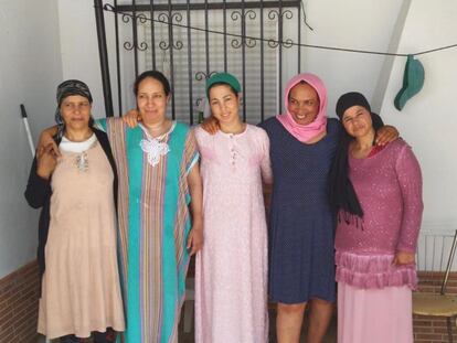 (l-r) Fatna, Saidia, Najiya and two other migrant workers from Morocco outside their home in Huelva province.