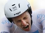 Slovenia's Tadej Pogacar wins and takes the overall leader's yellow jersey as he crosses the finish line of stage 20 of the Tour de France cycling race, an individual time trial over 36.2 kilometers (22.5 miles), from Lure to La Planche des Belles Filles, France, Saturday, Sept. 19, 2020. (AP Photo/