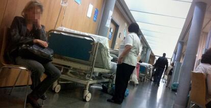 Patients lie in the corridor of an emergency ward at a Madrid hospital.
