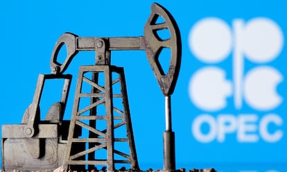 A 3D printed oil pump jack is seen in front of the OPEC logo