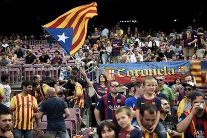 A Barça fan waves an ‘estelada’ Catalan nationalist flag at Camp Nou.