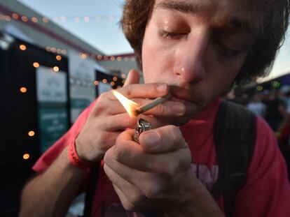 In this file photo a man lights a joint at the annual DOPE Cup, a cannabis competition in Portland, Oregon, on October 4, 2015.