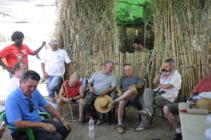 Juan Manuel Sanchez Gordillo (on telephone) at the squatter camp in Osuna. Arrest warrants have been issued for the mayor and his followers.