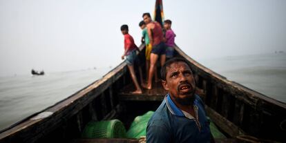 The Wider Image: Rohingya refugees fish in troubled waters