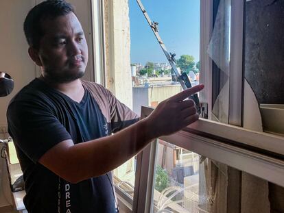 Gershon Maté shows the effects of the Hezbollah attack at his house in Acre. 