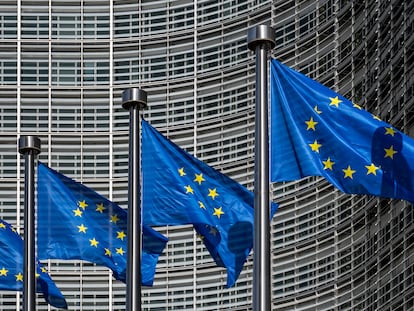 European flags in front of headquarters of European commission in Brussels in summer day