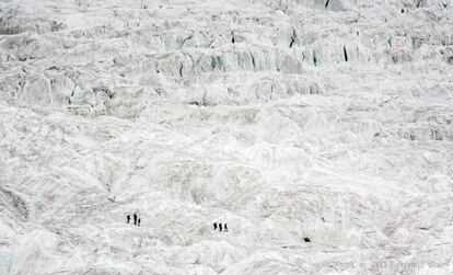 The climbers descend a glacier.