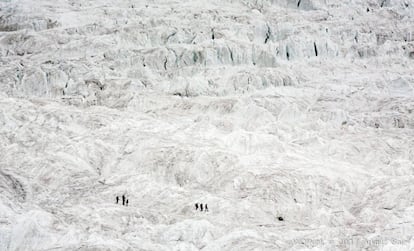 The climbers descend a glacier.