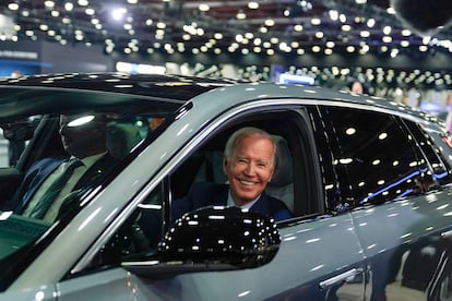 President Joe Biden drives a Cadillac Lyriq through the show room during a tour at the Detroit Auto Show, Sept. 14, 2022, in Detroit.