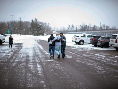 Thomas Rhodes, center, walks out of the Minnesota Correction Facility in Moose Lake, Minn., on Friday, Jan. 13, 2023.