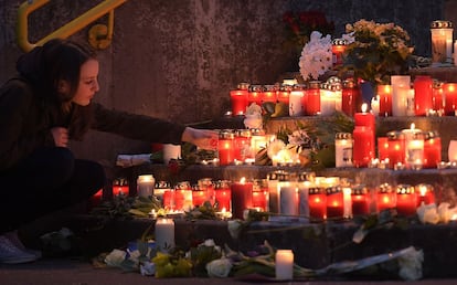 A student lights a candle outside the Joseph-Koenig gym in Germany. Sixteen of the passengers on the flight that crashed in the French Alps were German students returning home after spending a week at a Barcelona high school as part of an exchange program.