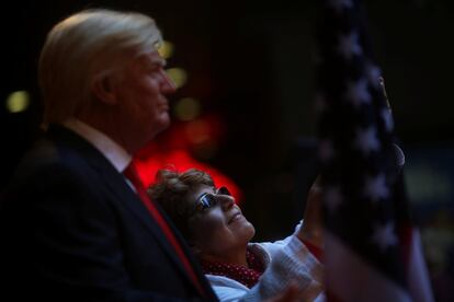 A woman takes a selfie with a life-sized wax statue of U.S. President-elect Donald Trump during an unveiling ceremony at Madrid's wax museum in Madrid, Spain, January 17, 2017. REUTERS/Susana Vera