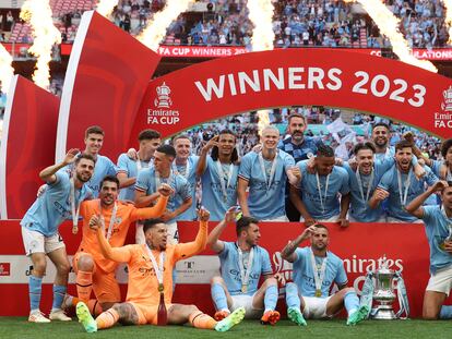 Manchester City players celebrate winning the English FA Cup final football match between Manchester City and Manchester United at Wembley stadium, in London, on June 3, 2023.